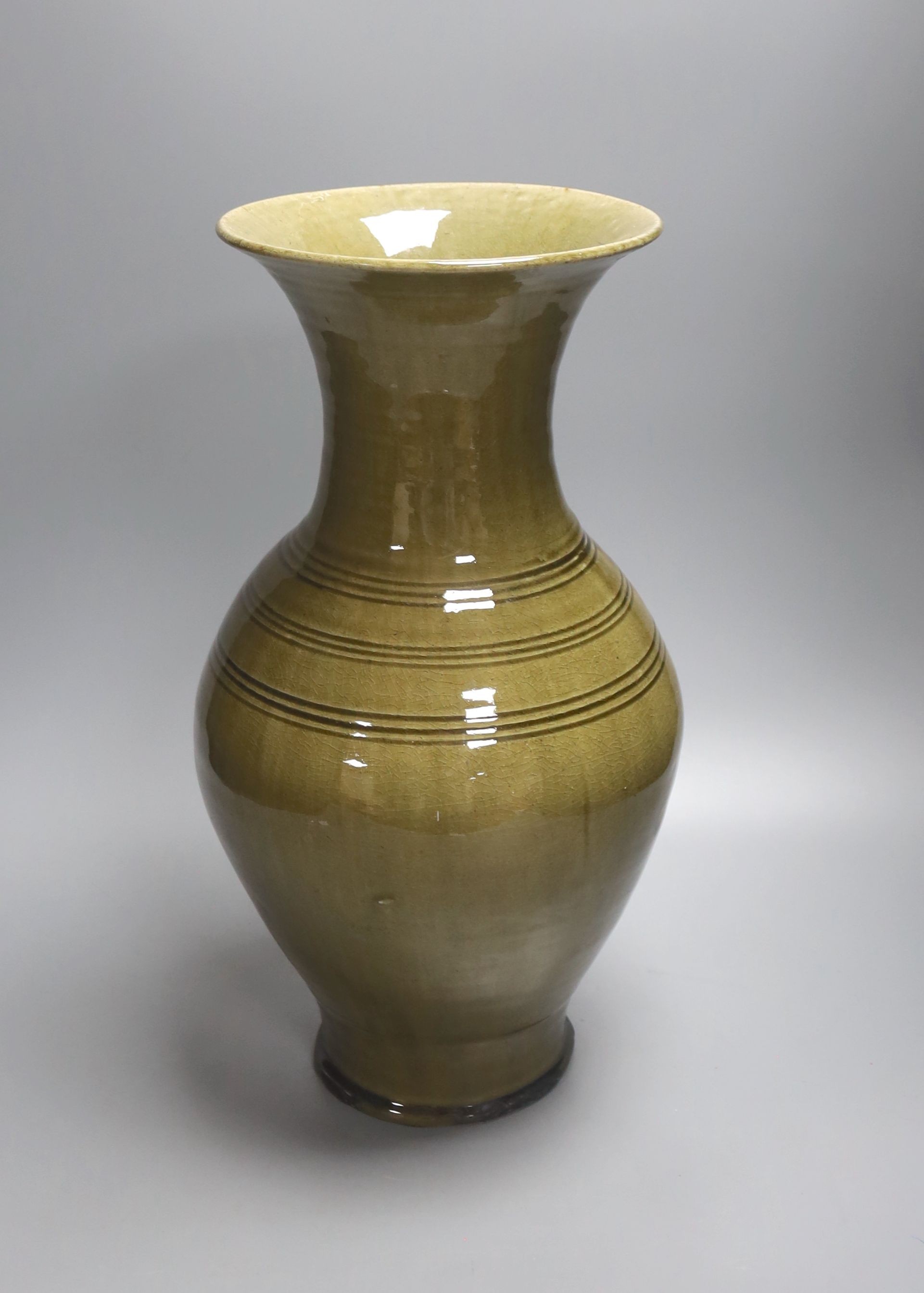 A large Chinese olive green glazed stoneware vase 40cm